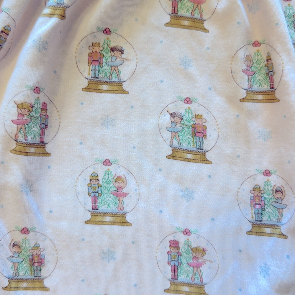 Pink Baby Romper with snow globe Nutcracker pattern